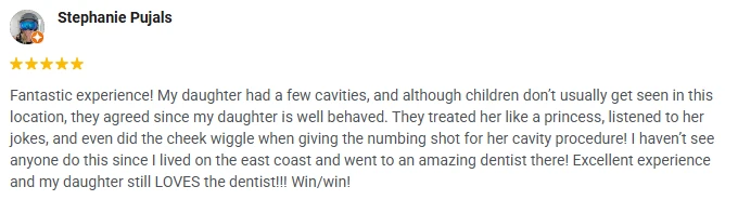 A 5-star Google review of iSmilespa praising how the clinic works with children